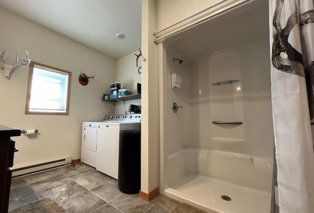 bathroom with a shower with shower curtain, a baseboard radiator, vanity, and washing machine and dryer