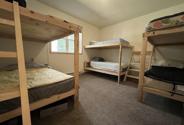 carpeted bedroom featuring a baseboard radiator