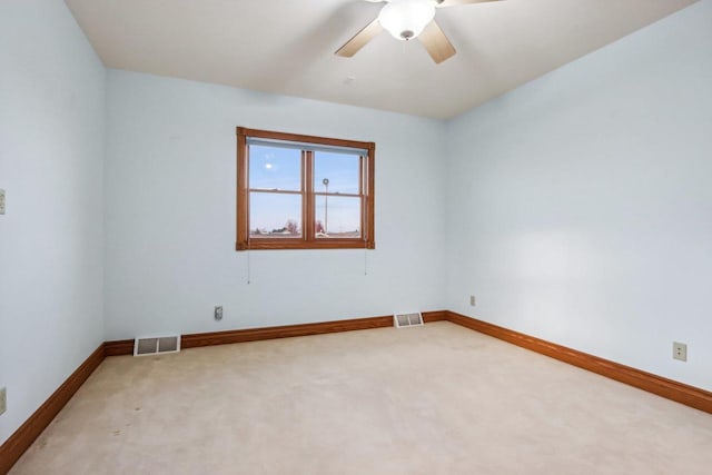 empty room with carpet flooring and ceiling fan