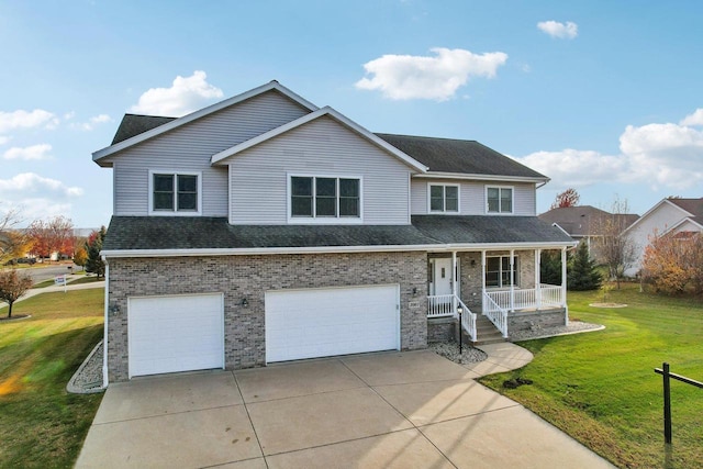 view of front of house featuring covered porch, a garage, and a front yard