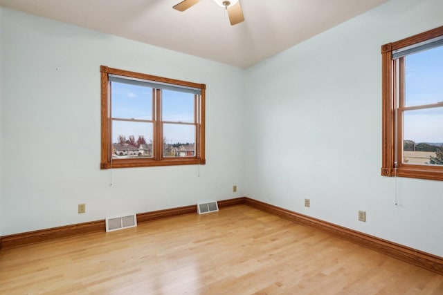 unfurnished room with ceiling fan and light hardwood / wood-style flooring