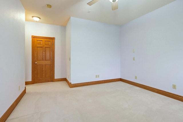 spare room with carpet flooring and ceiling fan