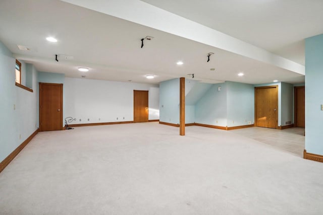 basement featuring light carpet