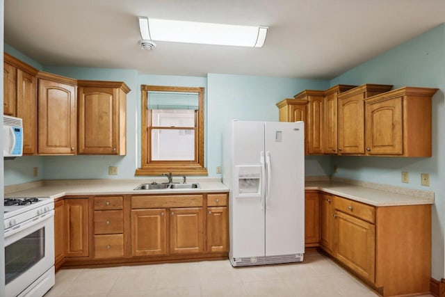 kitchen with white appliances and sink