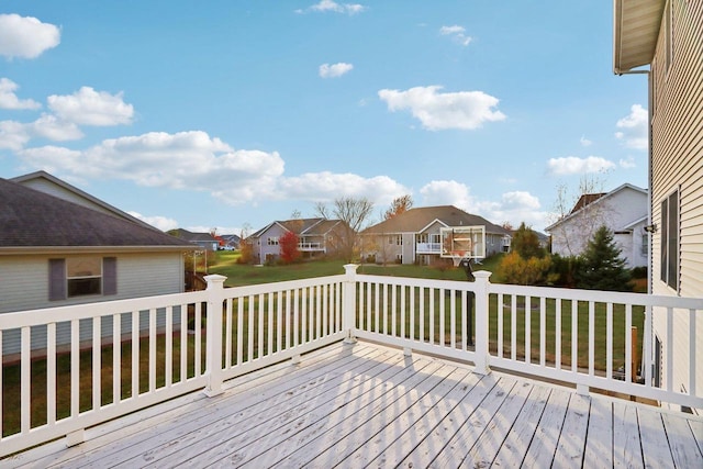 wooden deck with a lawn