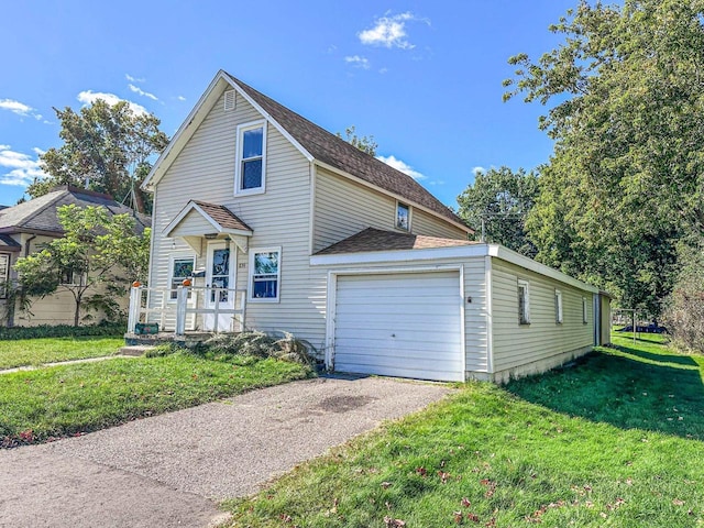 view of front property featuring a front yard and a garage