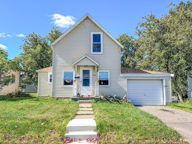 view of front facade with a front yard and a garage