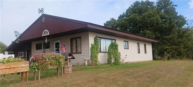 view of home's exterior featuring a yard