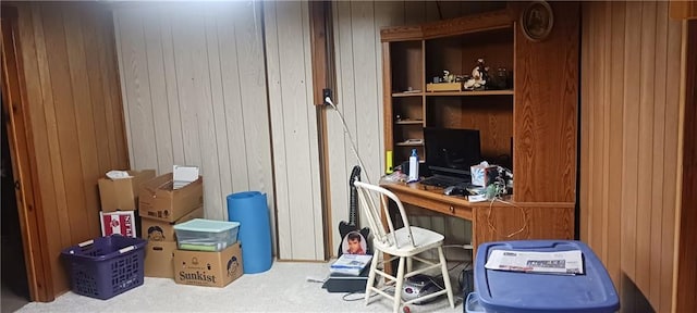 office with carpet floors and wooden walls