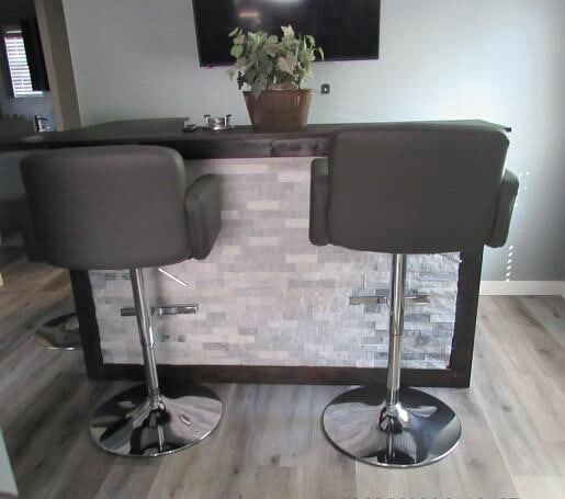 bar featuring light hardwood / wood-style flooring