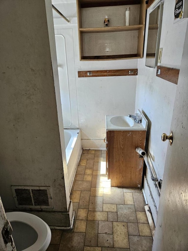 full bathroom with tub / shower combination, vanity, and toilet