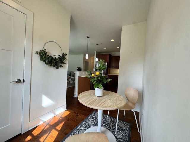 dining area with dark wood-type flooring