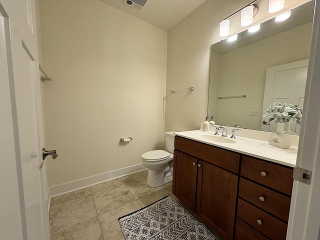 bathroom featuring vanity, toilet, and tile patterned floors