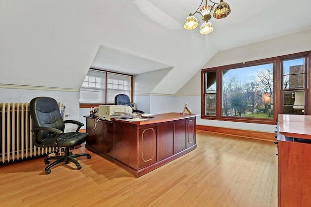 office area featuring light hardwood / wood-style flooring and lofted ceiling