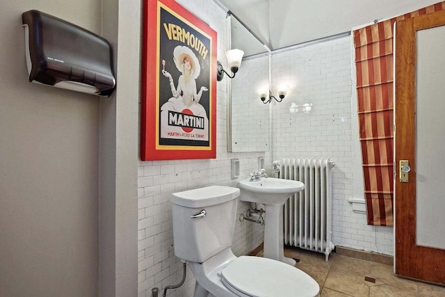 bathroom with radiator, tile walls, tile patterned flooring, and toilet