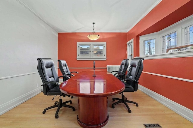 office area with crown molding and light hardwood / wood-style floors