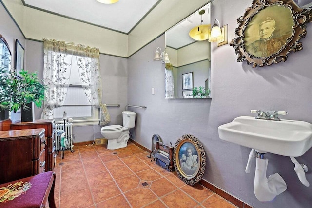 bathroom featuring toilet and tile patterned floors