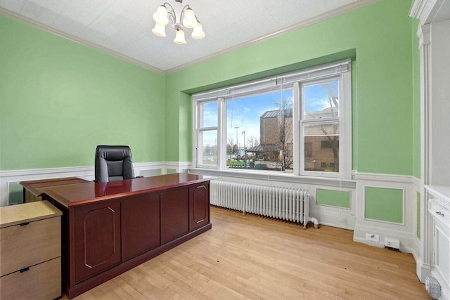 office space featuring light hardwood / wood-style flooring, radiator, a chandelier, and ornamental molding