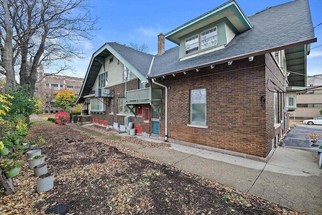 back of property with a balcony