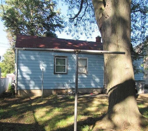 view of side of property featuring a yard