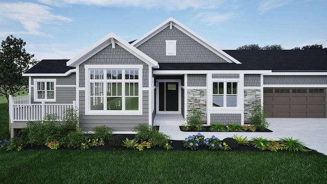 craftsman inspired home with a garage and a front lawn