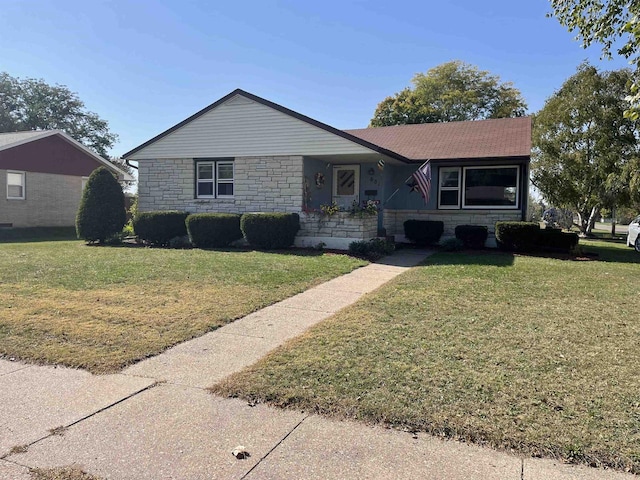 single story home with a front lawn