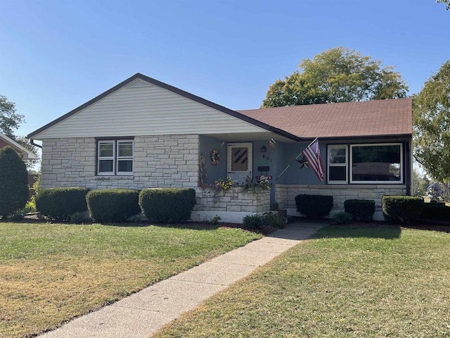 ranch-style home with a front lawn