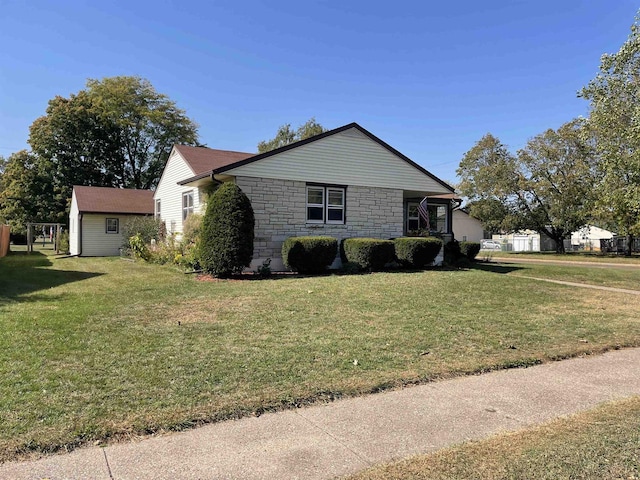 view of side of property with a yard