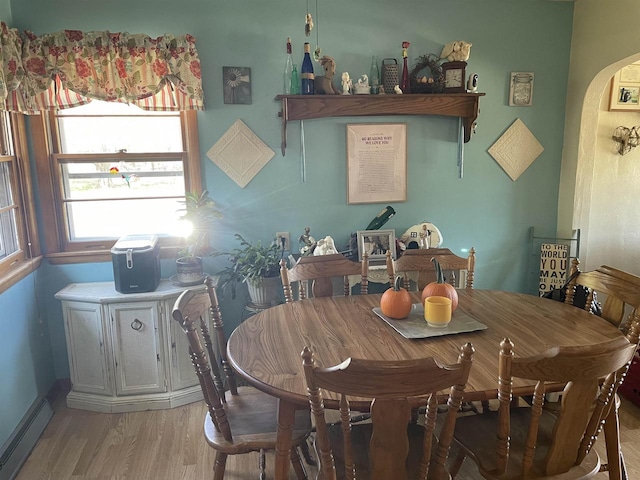 dining area featuring light hardwood / wood-style flooring and baseboard heating