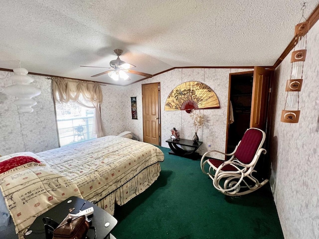 carpeted bedroom with ornamental molding, lofted ceiling, ceiling fan, and a textured ceiling