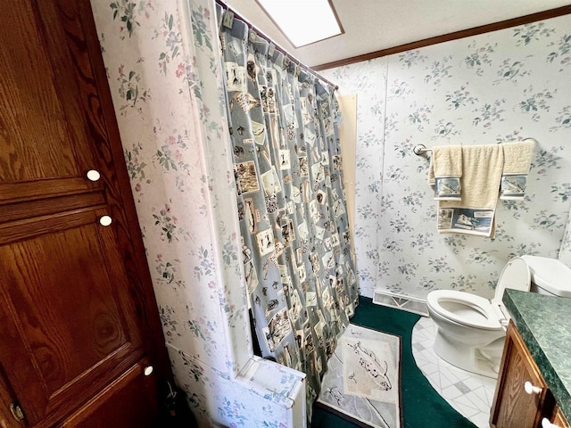 bathroom with vanity, crown molding, tile patterned flooring, a shower with shower curtain, and toilet