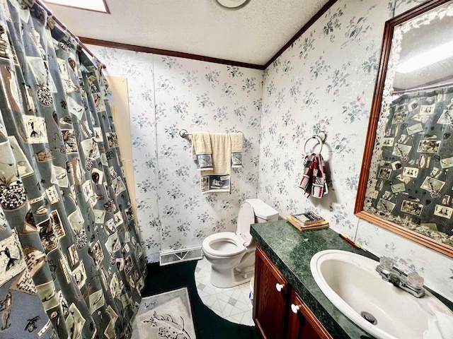 bathroom with a textured ceiling, crown molding, vanity, and toilet