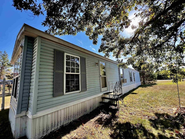 view of home's exterior with a lawn