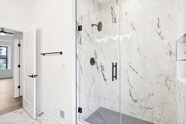 bathroom featuring hardwood / wood-style flooring and a shower with shower door