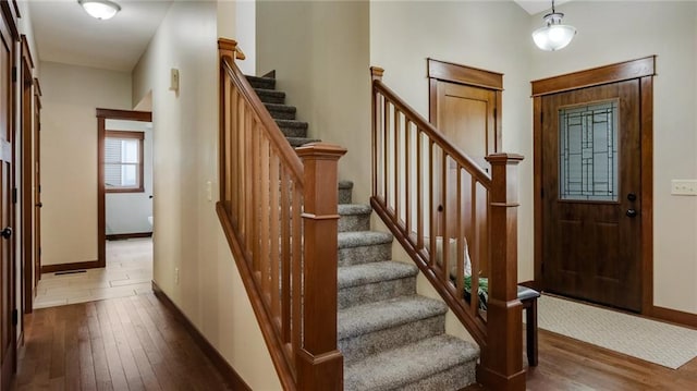 entrance foyer with dark hardwood / wood-style flooring