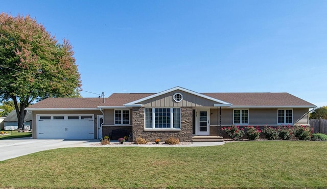 single story home featuring a garage and a front lawn