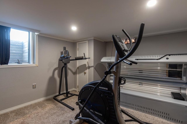 workout area with carpet flooring and ornamental molding