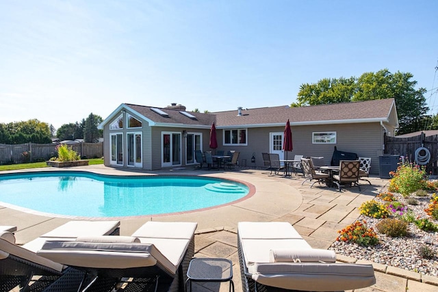 view of swimming pool featuring a patio area and central AC