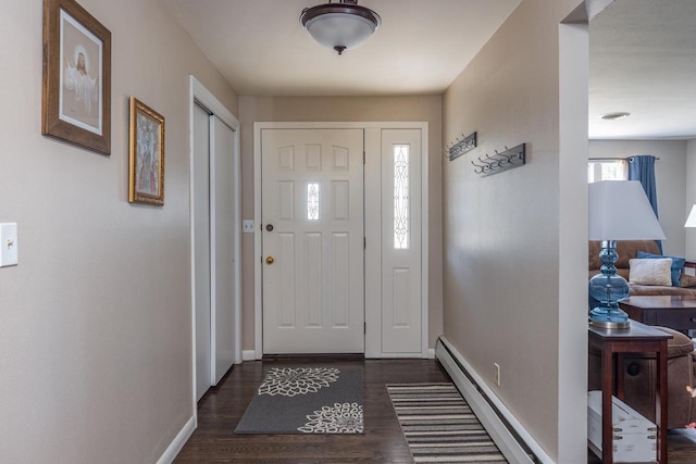 entrance foyer with dark wood-type flooring and a baseboard radiator