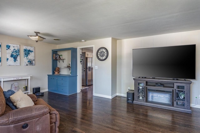 living room with dark hardwood / wood-style flooring