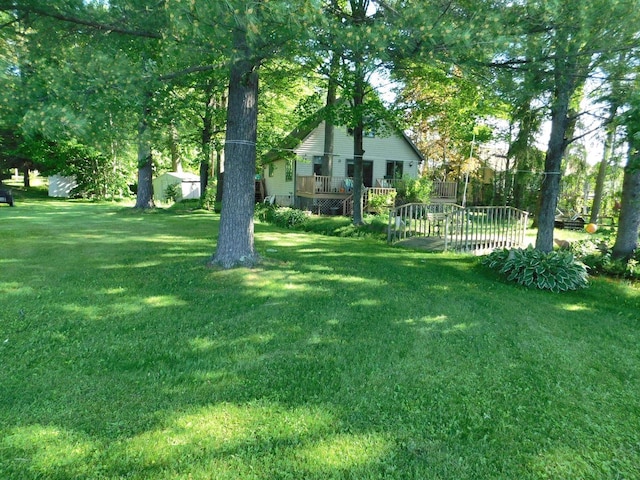 view of yard with a wooden deck