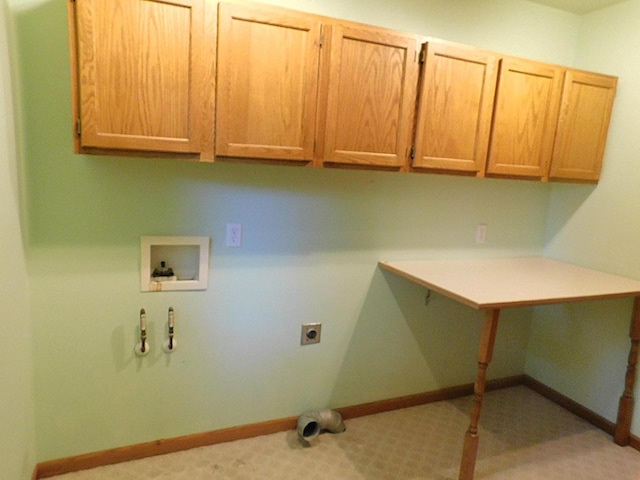 clothes washing area with electric dryer hookup, washer hookup, cabinets, and hookup for a gas dryer