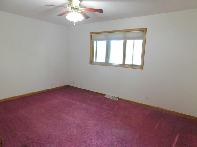 unfurnished room with carpet and ceiling fan