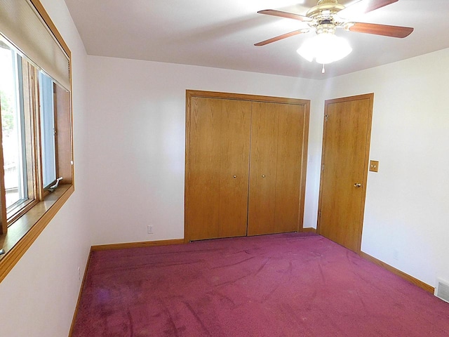 unfurnished bedroom with carpet floors and ceiling fan