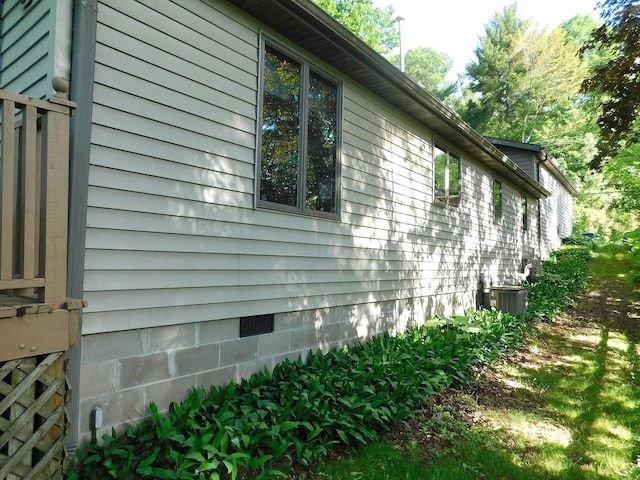 view of side of property featuring central AC