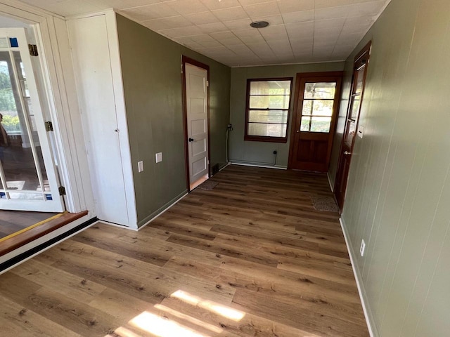 corridor with dark wood-type flooring