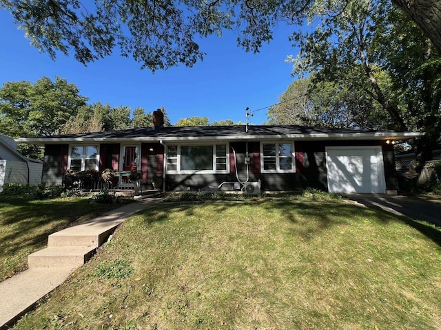 ranch-style house featuring a garage, a porch, and a front yard