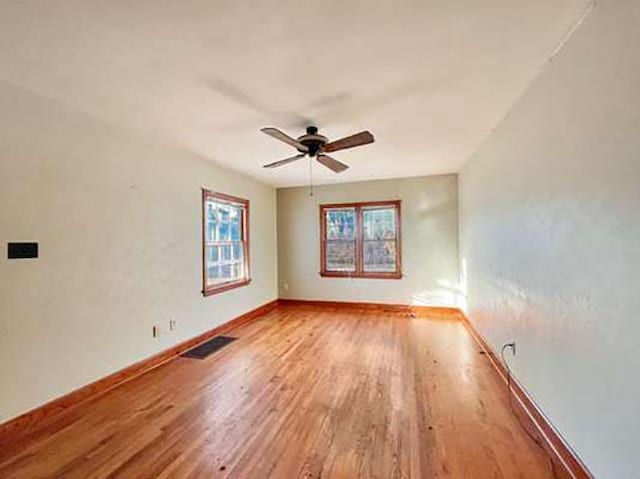 unfurnished room featuring wood-type flooring and ceiling fan