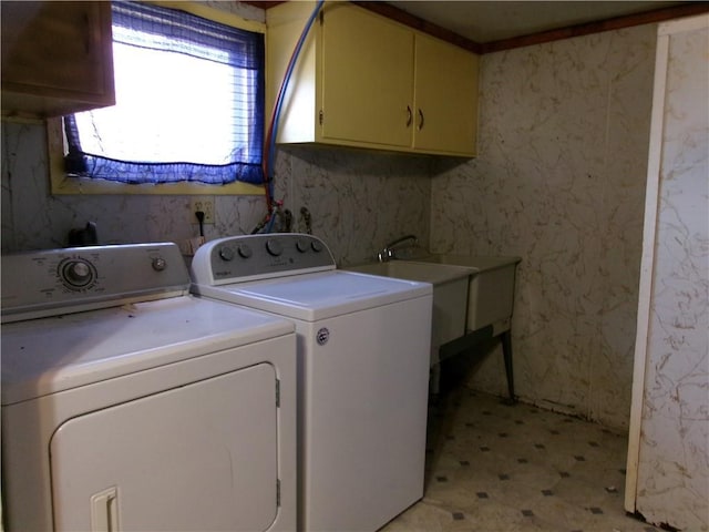 laundry room with cabinets and separate washer and dryer