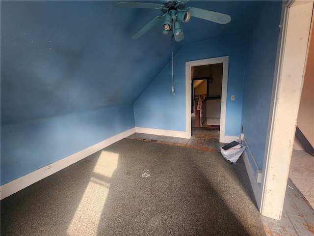 additional living space featuring carpet, lofted ceiling, and ceiling fan